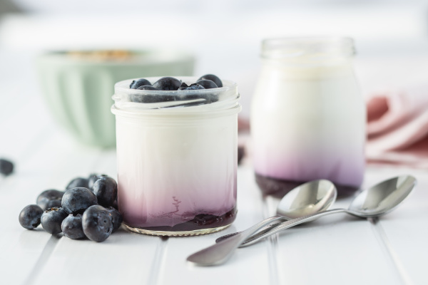white fruity yogurt in jar and