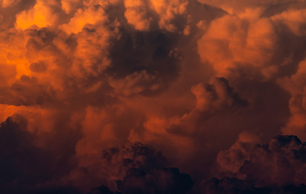 red orange fluffy clouds on