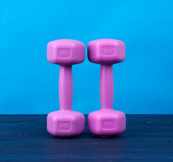 pink plastic dumbbells of one kilogram