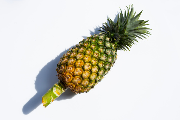 single whole pineapple on white background