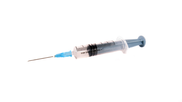 injection syringe on white background