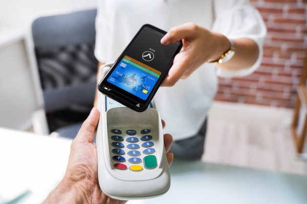 paying with mobile phone to cashier