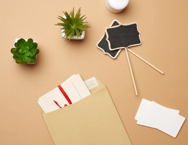 brown paper envelope and empty wooden