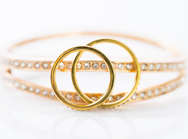 gold wedding rings on white background