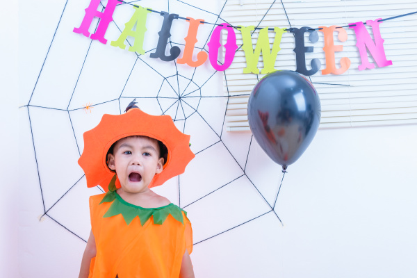 funny happy kid in halloween costume