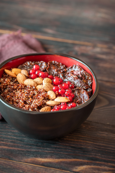 bowl of red quinoa with nuts