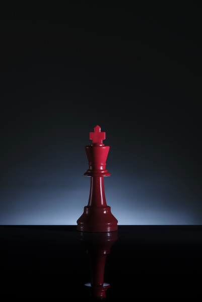 studio shot of red chess king