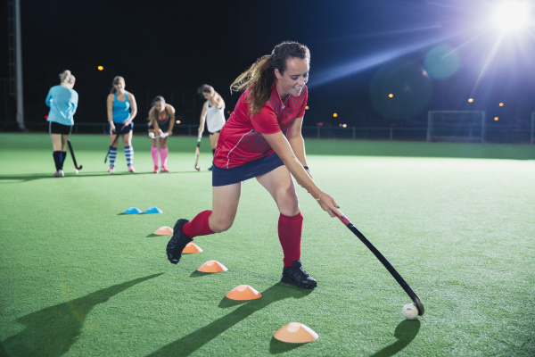 determined young female field hockey player