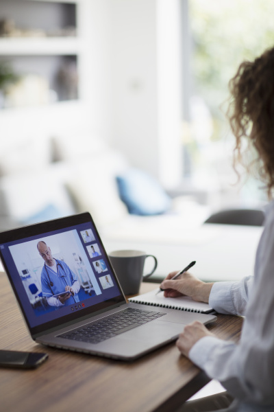 woman video conferencing with doctor on