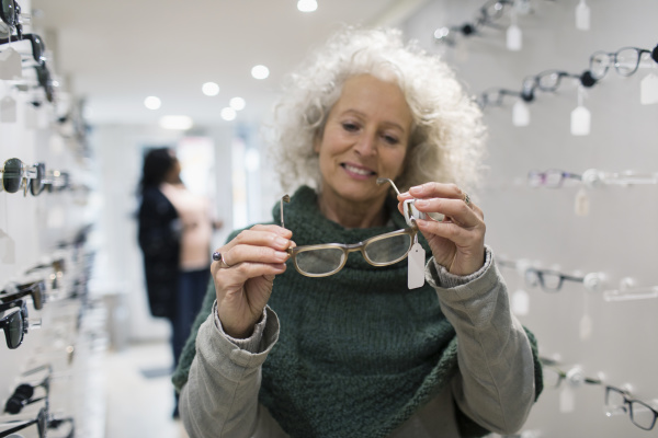 senior woman shopping for eyeglasses in