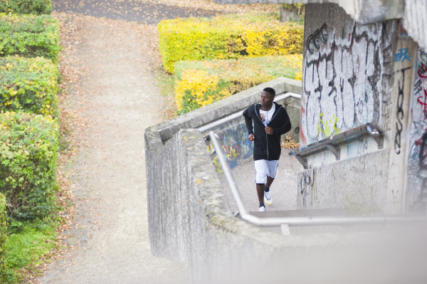young man jogging on steps
