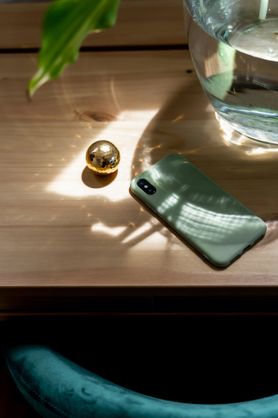 mobile phone by golden ball on