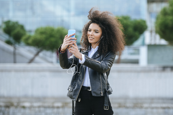 young afro woman taking selfie from