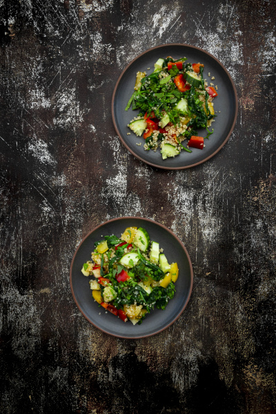 two plates of warm vegan salad