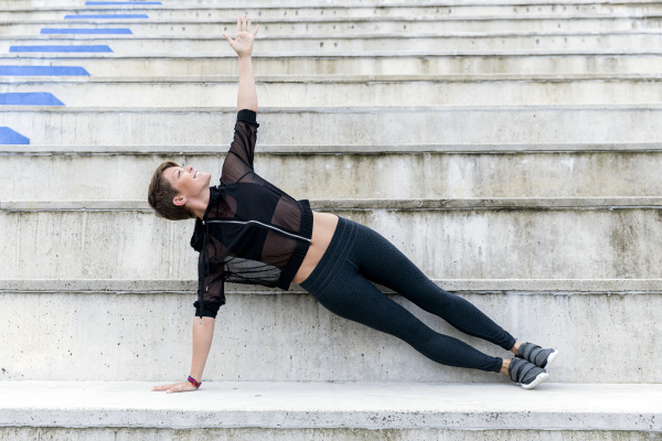 athletic woman during workout on stairs