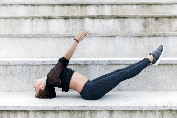 athletic woman during workout on stairs