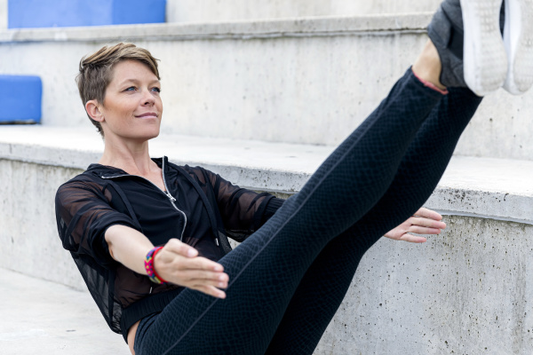 sportive woman during workout on stairs