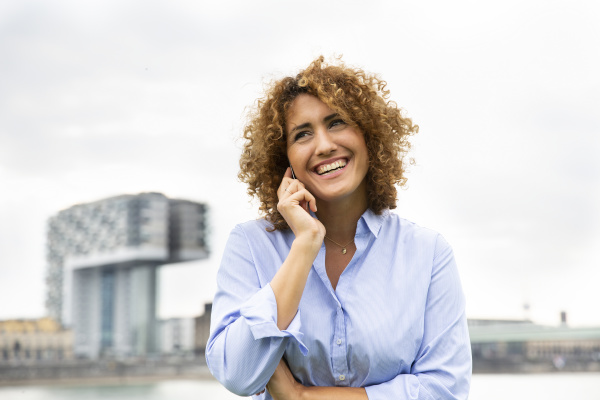 cheerful female entrepreneur with curly hair