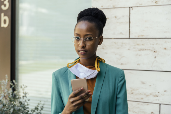 portrait of young businesswoman with protective
