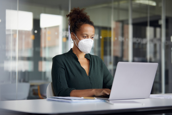 portrait of businesswoman wearing protective mask