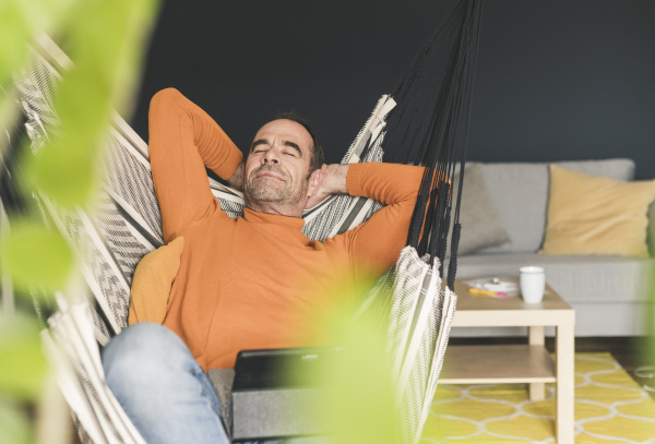 businessman relaxing while sitting with digital