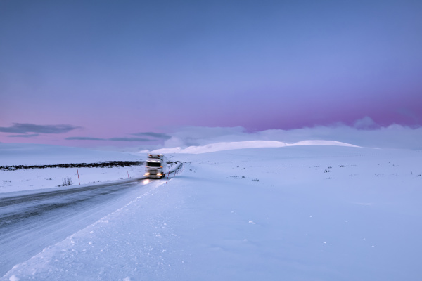 truck on country road in winter