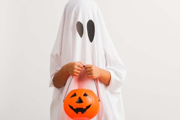 child with white dressed costume halloween