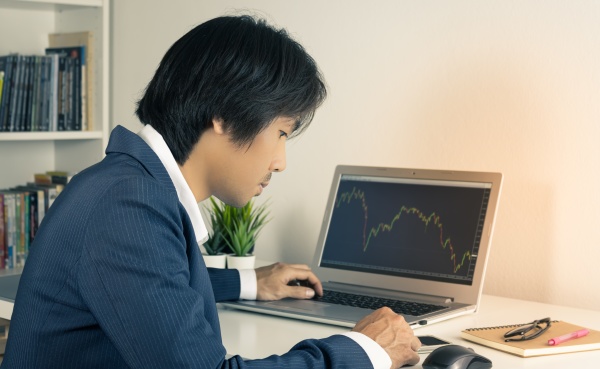 asian forex trader or investor touch