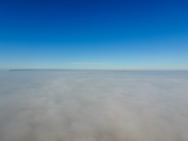 in the skies above the fog
