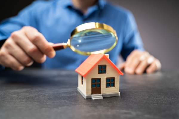 house or home inspection using magnifying