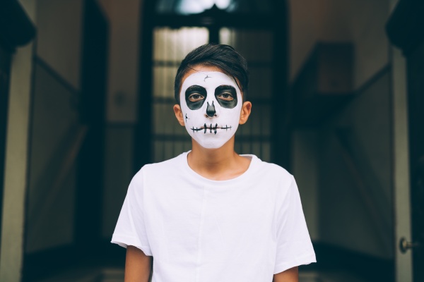 boy with halloween face paint
