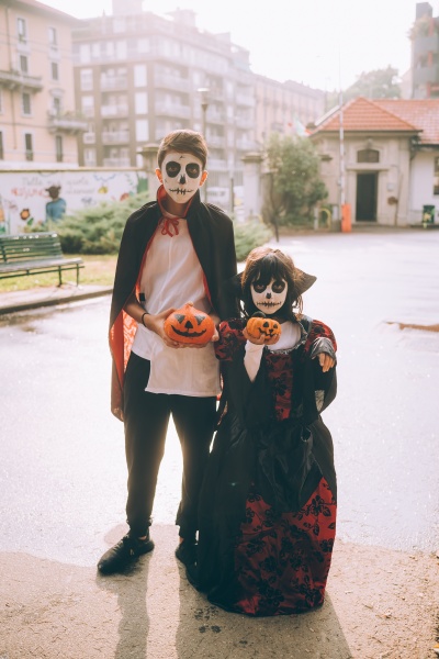 brother and sister in halloween costumes