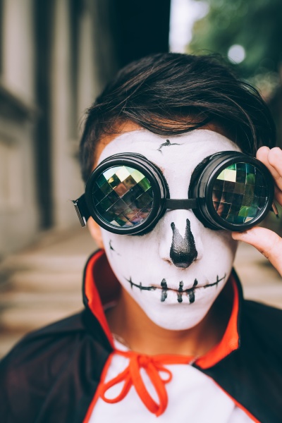 boy wearing halloween costume with face