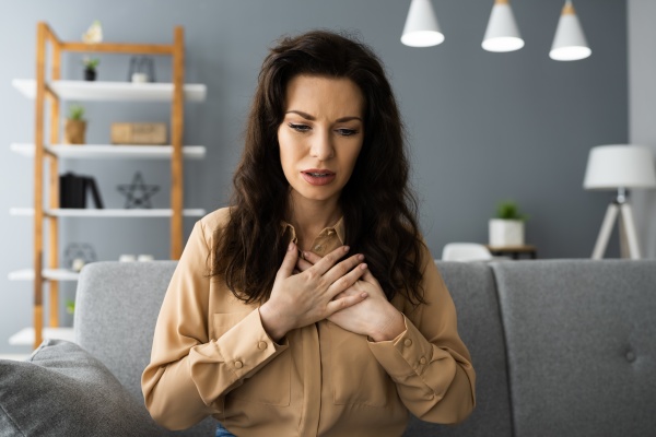 sick woman with chest pain