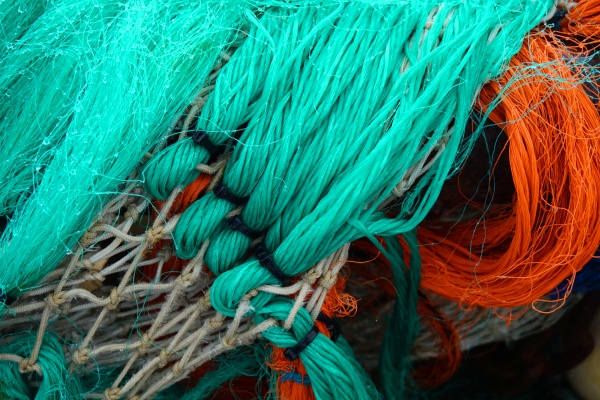 fishing net background with red turquoise