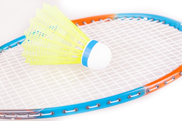 the shuttlecock on badminton racket closeup