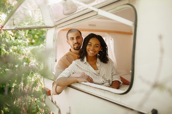 couple looks out of rv window