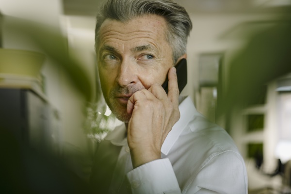 man talking on phone while standing