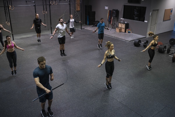 group of people training with jumping