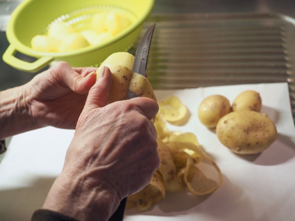 cook pealing potatoes