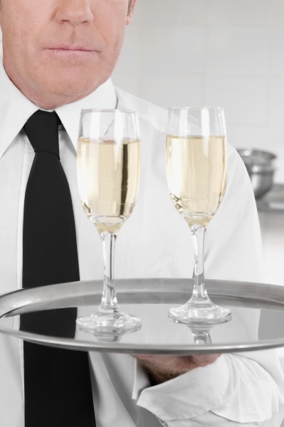 waiter holding a tray of champagne
