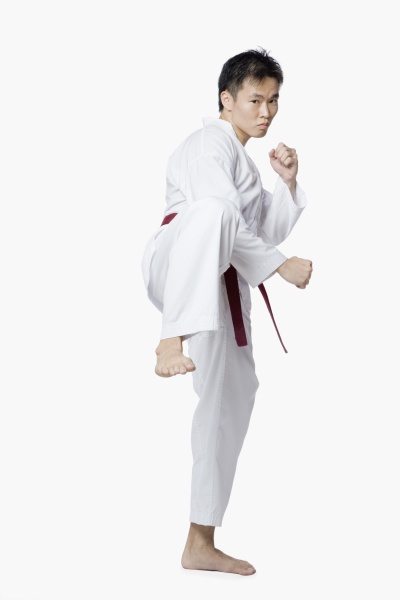 young man in side kick position