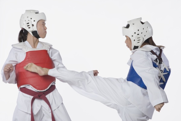 two taekwondo players fighting