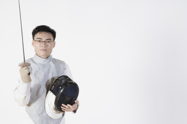 portrait of a male fencer holding