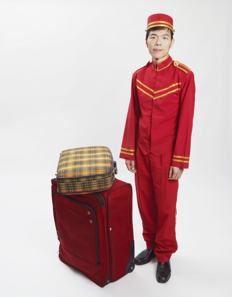 portrait of a bellhop standing with