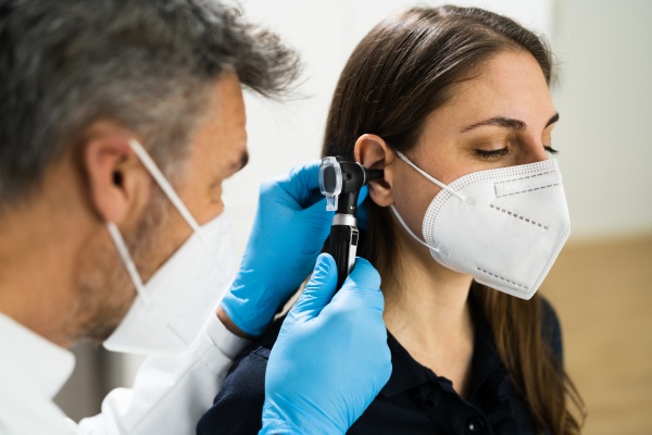 otolaryngology doctor examining patient ear