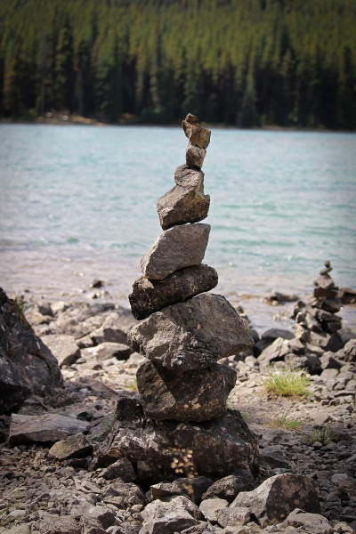 cairn stacks built along a lake