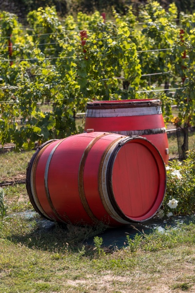 two old red barrels in a