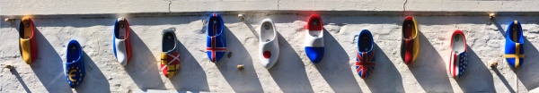 wooden clogs with country flags