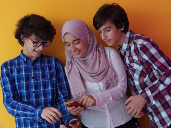 arab teenagers group using smart phones